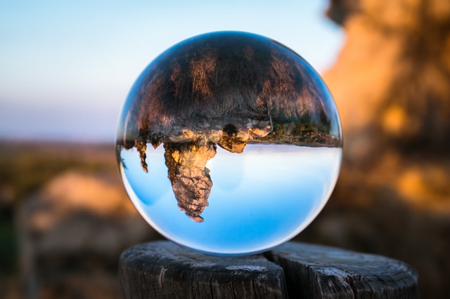 glass sphere showing inverted mountainscape