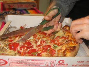 scissors cutting pizza