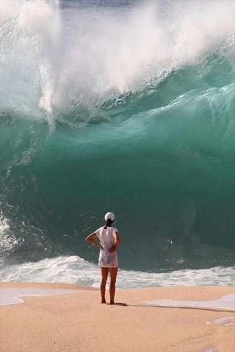 Person Standing in front of really big wave