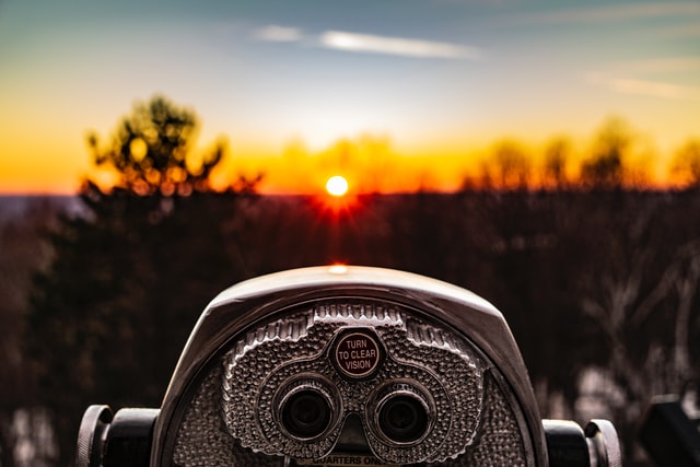 Binoculars looking at sunset