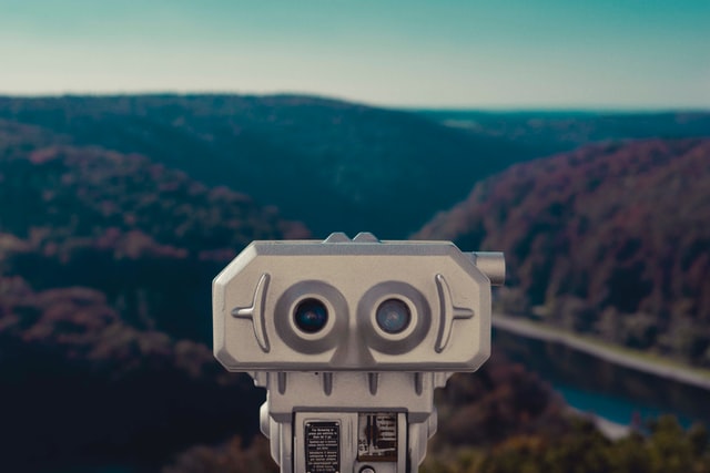 gray rectangular viewfinder looking out over canyon and river. Photo by Y Heng on Unsplash