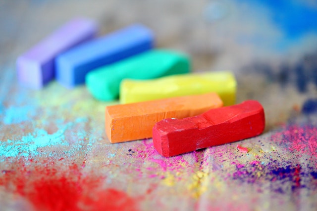 Varied colors of chalk on asphalt photo by Sharon McCutcheon on Pexels